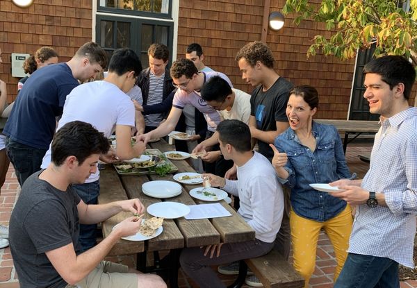 students enjoy meal together at end of class